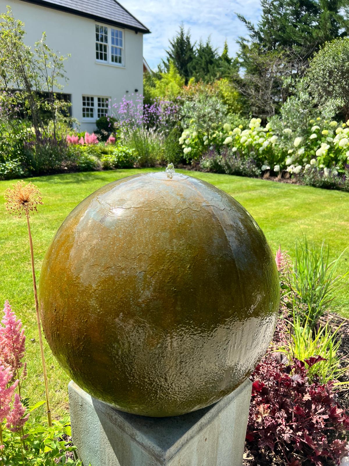 Sphere water feature set within the new planting scheme