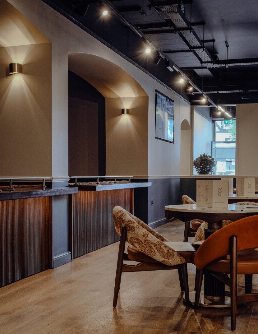 Bar and dining room under the exposed ceiling